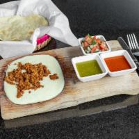 Choriqueso · Creamy fondue cheese with Mexican chorizo served with guacamole, pico de gallo, salsa and ha...