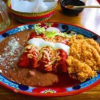 Enchilads Rojas · Served with rice and beans. Three enchiladas filled with shredded beef or shredded chicken, ...