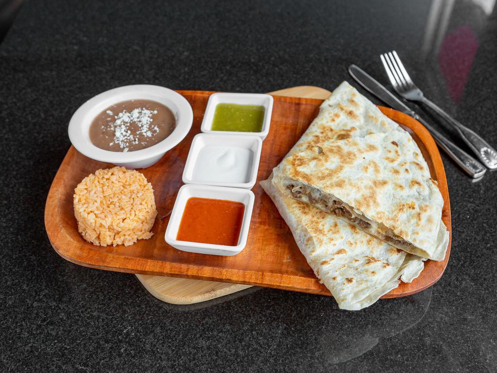 Quesadilla Nortena · Asada, Al pastor, Chorizo or Pollo. Flour tortilla filled with melted cheese and your choice of meat. Served with rice, beans, Mexican sour cream, green and red salsa.