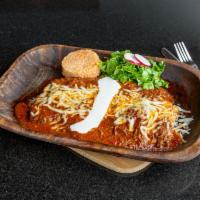Burrito Azabache · Shredded brisket simmered in guajillo, tomatoes and crushed chile de arbol peppers very spic...