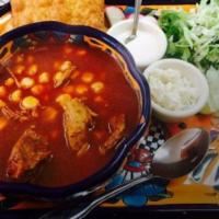 Pozole · Pre-Columbian soup made with a chile guajillo, chile ancho and tomato broth adding chicken o...