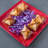 Pimento Cheese Wontons · Handcrafted and “to die for”. Wontons stuffed with in-house made pimento cheese sit atop a b...
