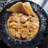 Shrimp and Grits · Grilled Cajun shrimp, Fire-roasted corn and andouille pork sausage over cheddar stone ground...
