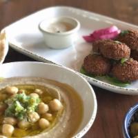 Hummus Mezza · A smooth medley of chickpeas, garlic, lemon juice, tahini drizzled with extra virgin olive o...