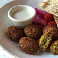 Falafel Mezza · Falafel, served with pickles and tahini sauce.