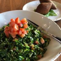 Tabbouleh Salad · Fresh chopped parsley, tomatoes, minced cucumbers, green onions, bulgur wheat, mint, fresh l...