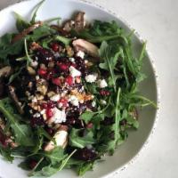 Arugula & Beet Salad · Baby arugula, roasted beets, mushrooms, onions, dates, walnuts tossed in our olive oil date ...