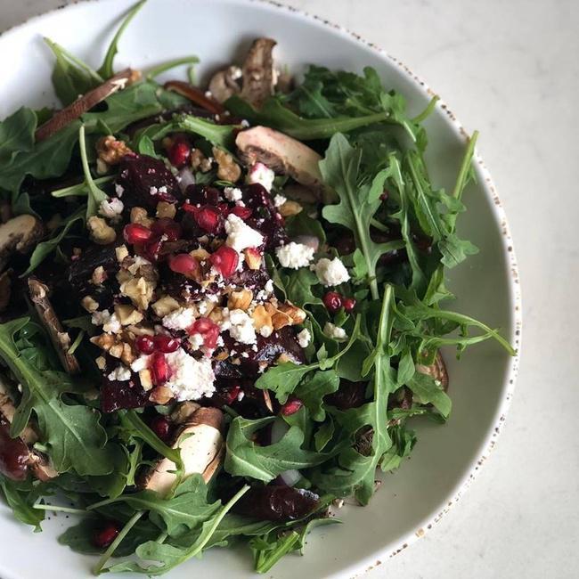 Arugula & Beet Salad · Baby arugula, roasted beets, mushrooms, onions, dates, walnuts tossed in our olive oil date dressing, topped with feta cheese and pomegranates!