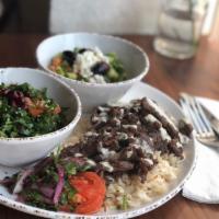 Beef Shawarma Plate · Beef shawarma served on a bed of vermicelli rice and your choice of 2 sides!