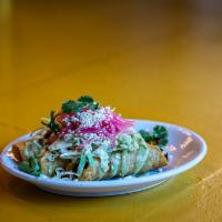 Sweet Potato & Black Bean Taquitos · Topped with cabbage, pickled onions, queso fresco & tahini crema.   Served with beans and ri...