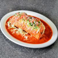 Colorado Burrito · Filled with beef chunks, rice, and beans under Colorado sauce. Finished with cheese, lettuce...
