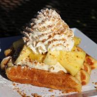 Pineapple Cheesecake Waffle · Fresh pineapple, our house cheesecake pudding, whipped cream and Graham cracker crumble, all...