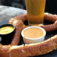 Pretzel with Beer Cheese · Giant pretzel served with a side of beer cheese and Stout Whole-Grain mustard. 