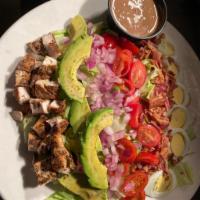 Cobb Salad · Romaine Lettuce, Bacon, Hard Boiled Egg,  Cherry Tomatoes, Red Onion and Grilled Chicken. Se...