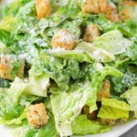Caesar Salad · Romaine lettuce, homemade garlic croutons and Parmesan cheese with a creamy Caesar dressing....