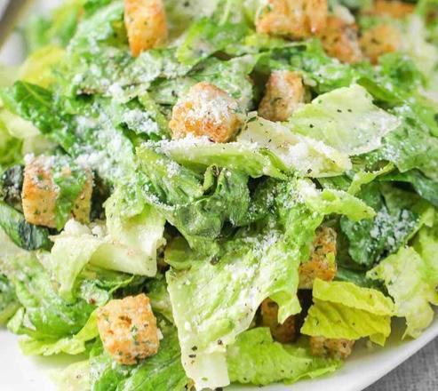 Caesar Salad · Romaine lettuce, homemade garlic croutons and Parmesan cheese with a creamy Caesar dressing. Add chicken for an extra charge.