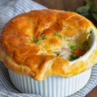 Chicken Pot Pie · Tender chicken breast and loads of vegetables in a hearty sauce topped with puff pastry.