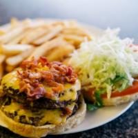 Rubalcaba Monster Burger with Fries · Double meat, cheese, bacon, avocado, tomato, lettuce and ketchup.