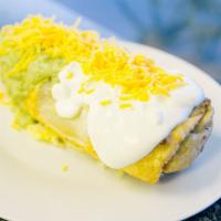 Lengua Chimichanga · Fried burrito with lengua (tongue) meat, beans and cheese inside topped with guacamole, sour...