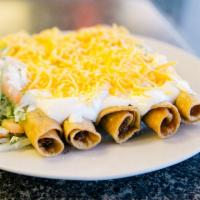 5 Rolled Tacos · Shredded beef or chicken rolled taquitos with guacamole, sour cream, cheese, lettuce and pic...