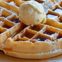 Belgian Waffle · A thick golden brown belgian waffle sprinkled with powdered sugar and served with whipped bu...