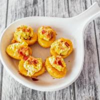 Deep-Fried Deviled Eggs · 6 mighty fine deep fried deviled eggs topped with sweet bacon.