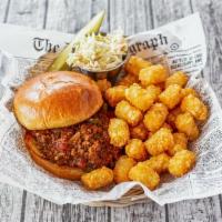 Sloppy Tot · Sloppy joe meat, on a buttery bun served on a bed of tater tots and coleslaw.