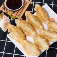 Potstickers  · Lightly fried or steamed pork and vegetable dumplings.(8pcs)