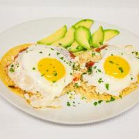 Huevos Rancheros · Rancher’s eggs sunny side up eggs. Served on corn tortillas with beans, rice, guacamole, sal...