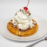 Bananachoconella Waffle · Layered Nutella, bananas and 2 scoops of vanilla ice cream topped with whipped cream.
