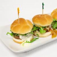BBQ Beef Brisket Sliders · Slow roasted brisket with BBQ sauce, topped with goat cheese, arugula and crispy onions.