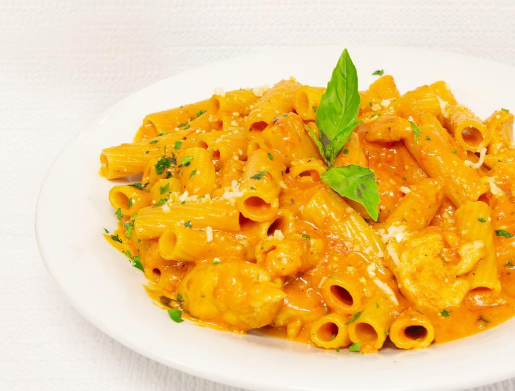Rigatoni ala Vodka  · Rigatoni pasta with crushed plum tomatoes in our light pink cream sauce with a touch of vodka.