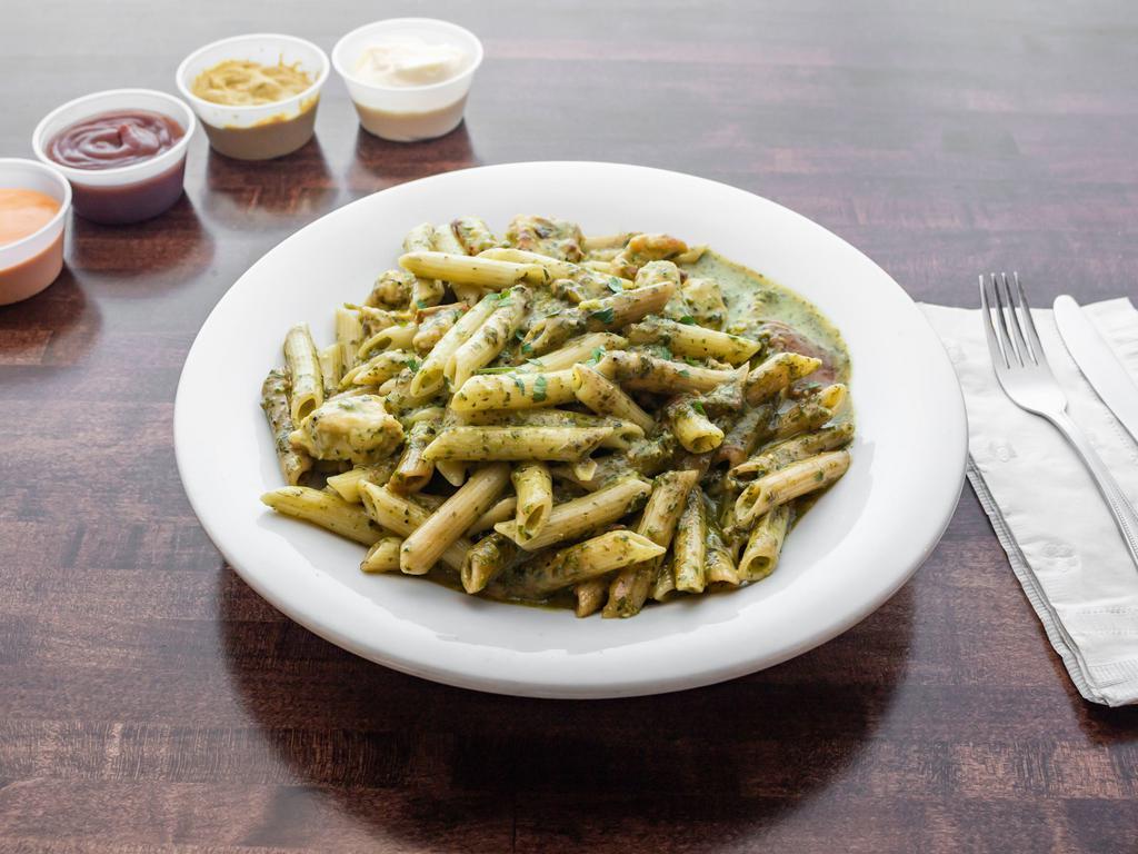 Chicken Penne Pesto · Penne pasta tossed with chicken and fresh tomatoes in our pesto sauce.