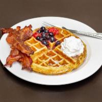 Classic Waffle · Topped with whipped cream, and mixed berry compote. Vegetarian.