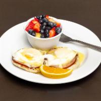 Classic Benedict · 2 eggs any style and Canadian bacon served on a toasted English muffin and topped with our h...