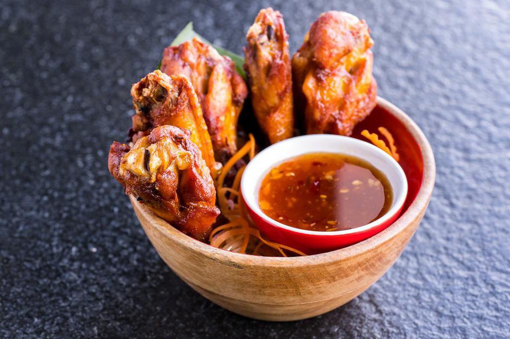 Fried Chicken Wings · Six (6) pieces. Deep-fried chicken wings. Served with house-made sweet chili sauce.