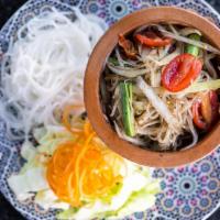 Thum Mak Hoong (Gluten-Free) · Mildly spiced. Lao style papaya salad. Shredded green papaya salad with cherry tomatoes and ...