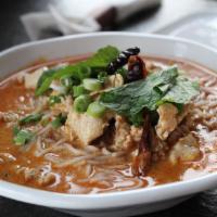 Ka Poon Soup (Gluten-Free) · Mildly spiced. Traditional Lao noodle soup in curry-flavored coconut broth, ground chicken, ...