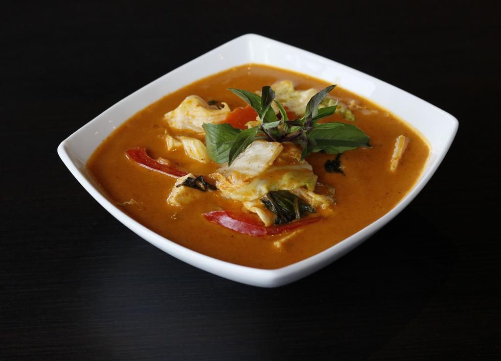 Red Curry (Gluten-Free) · Mildly spiced. Coconut red curry with eggplant, red bell peppers, green bean, bamboo shoots, and fresh thai holy basil. Served with jasmine rice and choice of tofu, chicken, or tiger prawns.
