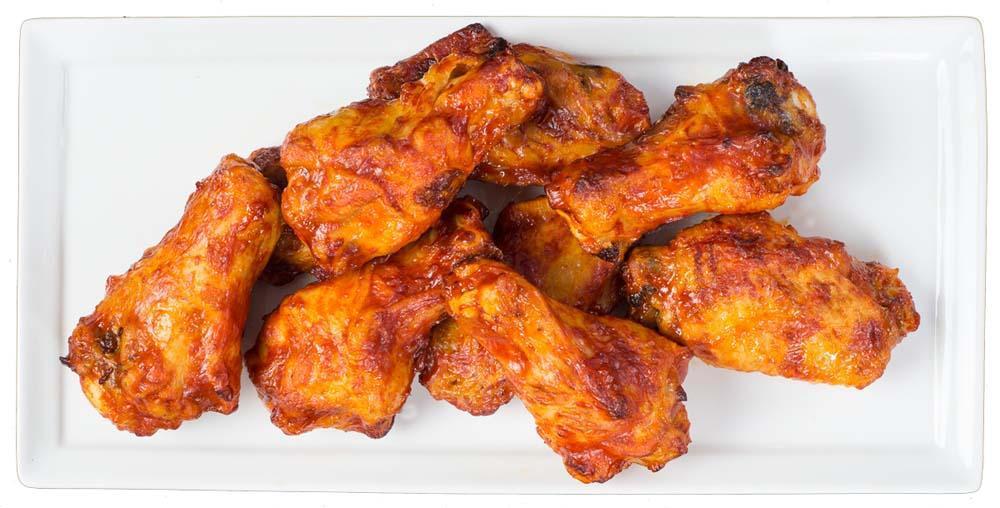 Hot 'n Spicy Buffalo Chicken Wings · A full pound of oven-roasted chicken wings tossed in our fiery buffalo sauce and baked to perfection. Served with your choice of dip.