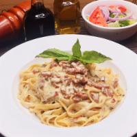 Fettuccine Carbonara · Fettuccine pasta in a rich cream sauce with bacon and onion.