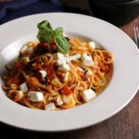 Spaghetti al Telefono · Spaghetti pasta with fresh tomato basil and mozzarella cubes.