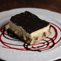 Tiramisu · Ladyfingers dipped in coffee, layered with a whipped mixture of eggs, sugar, mascarpone chee...