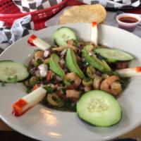 Ceviche Pura Vida · Shrimp and octopus, lime juice, tomatoes, olive oil, onions, peppers, cilantro and jalapeno....