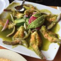 Camaron Aguachiles · Shrimp, cilantro and jalapenos. Shrimp marinated on a delicious spicy lime based green sauce...
