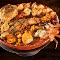 Parrillada en Barro for 2 · Lobster tail, jumbo shrimp, fish, crab meat, octopus, oyster and hot sauce. Served in a bed ...