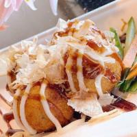 A8. Takoyaki (Octopus Bites) · Fried Octopus Balls served with Japanese mayonnaise and Japanese Barbecue sauce with Bonito ...