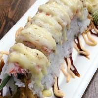 S25. Spiderman Roll · fried soft shell crab with cucumber and avocado, topped with seared imitation shredded crabm...