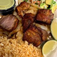 Pork Carnitas · Slowly-cooked pork layered over a bed of grilled onions. Served with sliced avocado, sour cr...