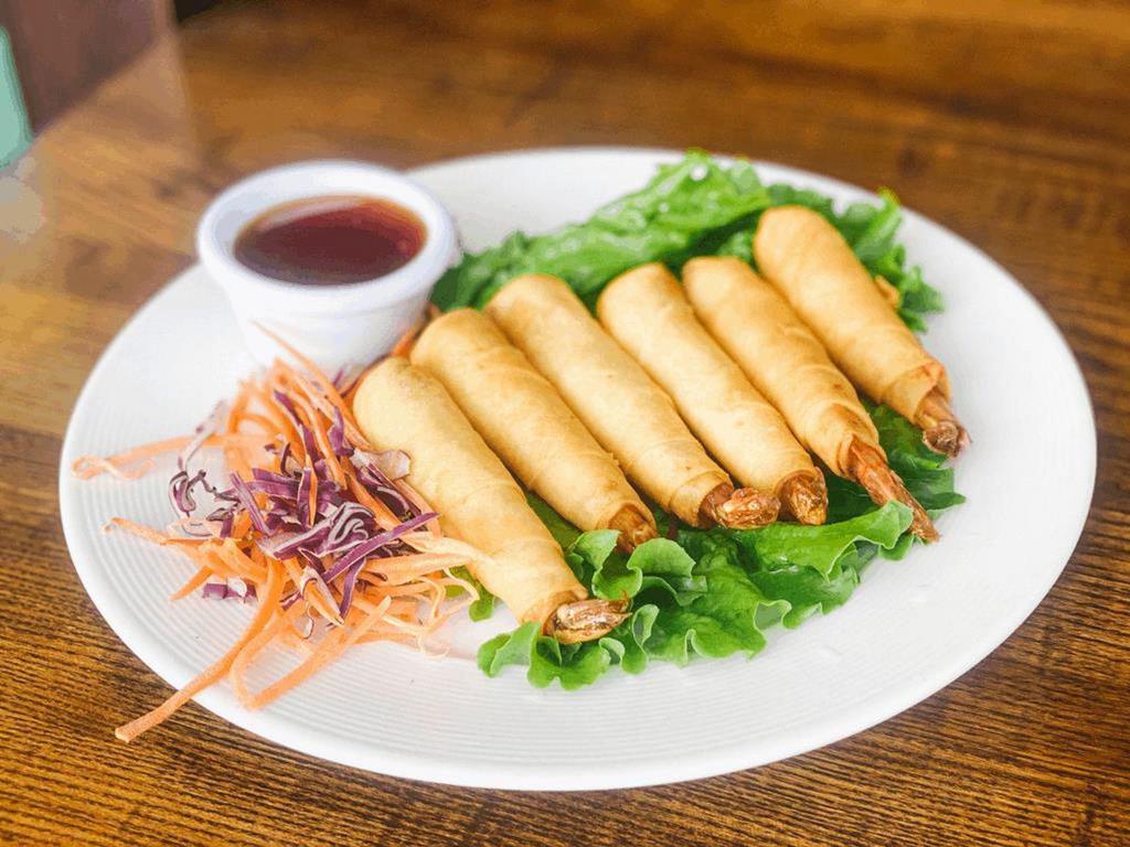 10. Prawn Rolls  · Coconut battered prawns deep fried to golden brown and served with plum sauce.